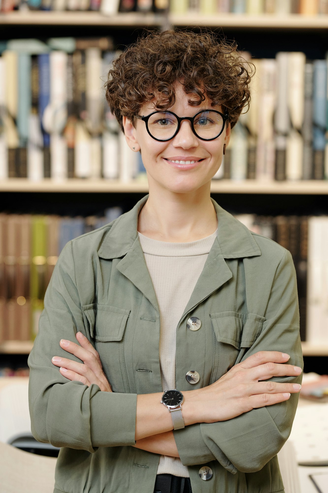 Young smiling confident female shop assistant or manager of interior design